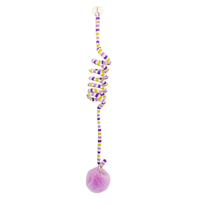 Colourful spring cat toy with hanging bell stick and inflatable ball, shown with a white suction cup.