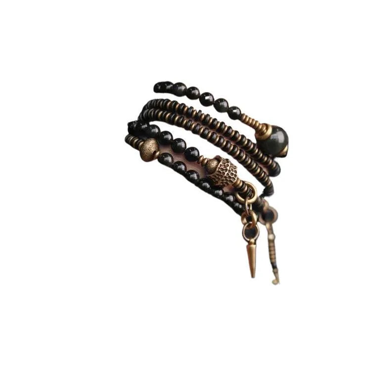 Black multi-layered beaded bracelet with geometric shapes showing natural style design