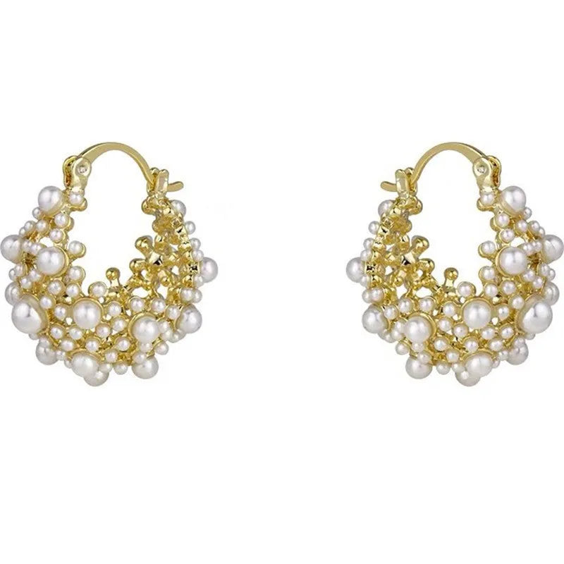 Gold floral basket-shaped women's earrings made from small rice beads with pearl inlay on copper.