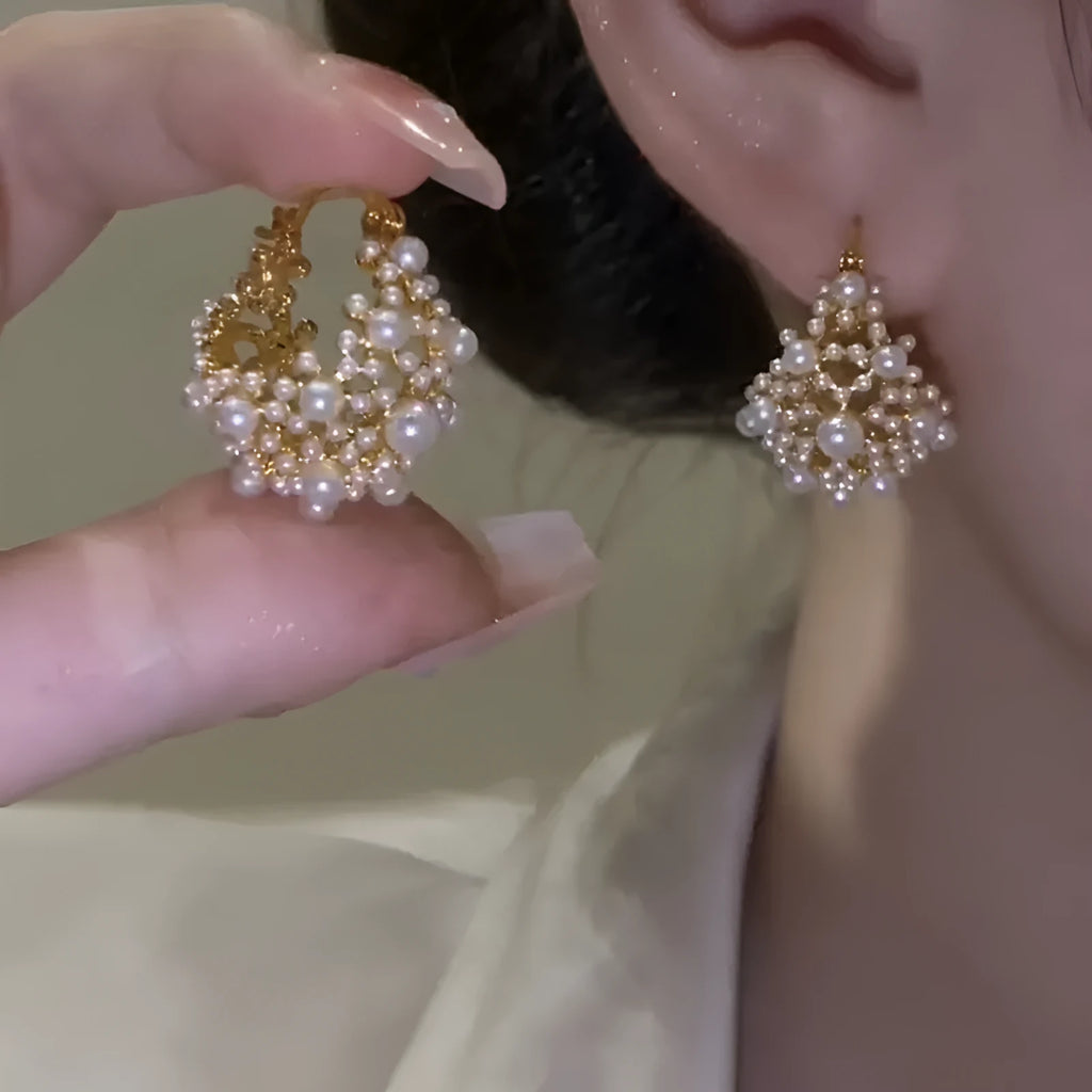 Gold floral basket-shaped women's earrings made from small rice beads with pearl inlay on copper.