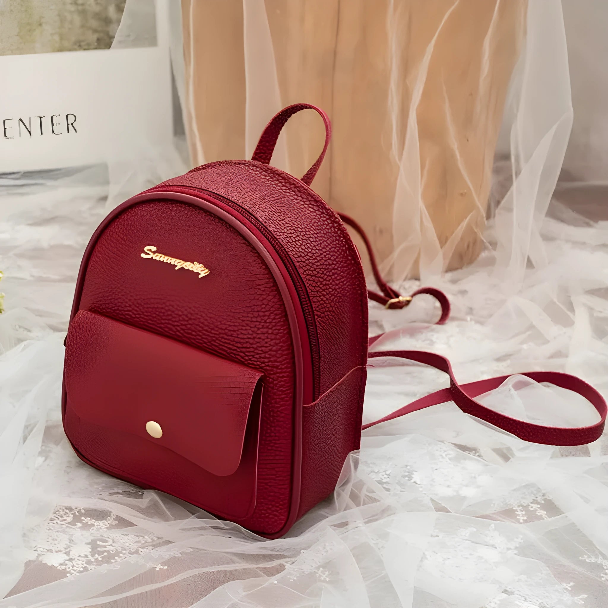 Women's small black PU backpack purse with letter design and zipper closure