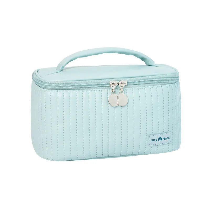 Open-top round cake-shaped makeup bag in a solid PU leather colour from the pink, coffee, beige, blue, green, purple range.