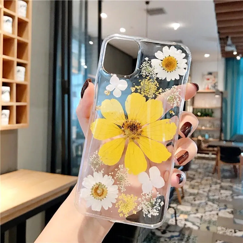Pink and yellow floral pattern TPU back cover case for iPhone on a white background.