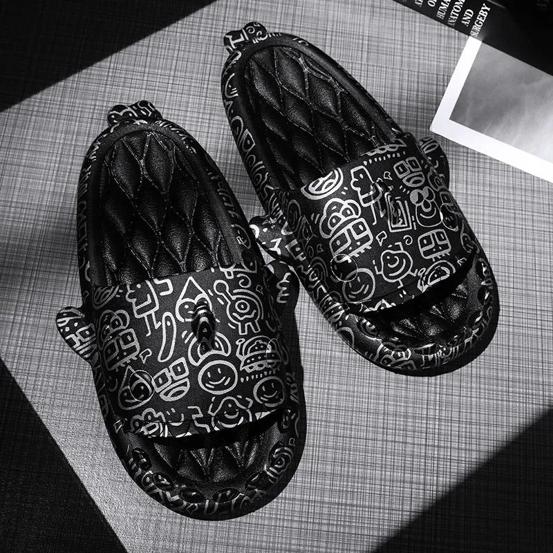 Beige and black EVA open-toe home slippers with a shark design on the front, shown as a couple's pair.