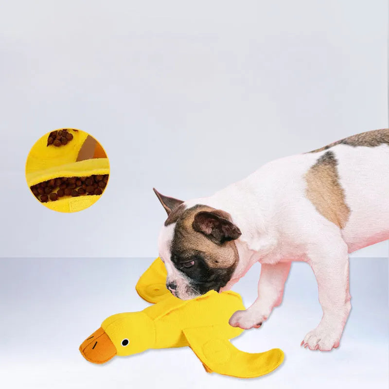 Yellow teddy bear duck plush dog toy with squeaker and treat holes.