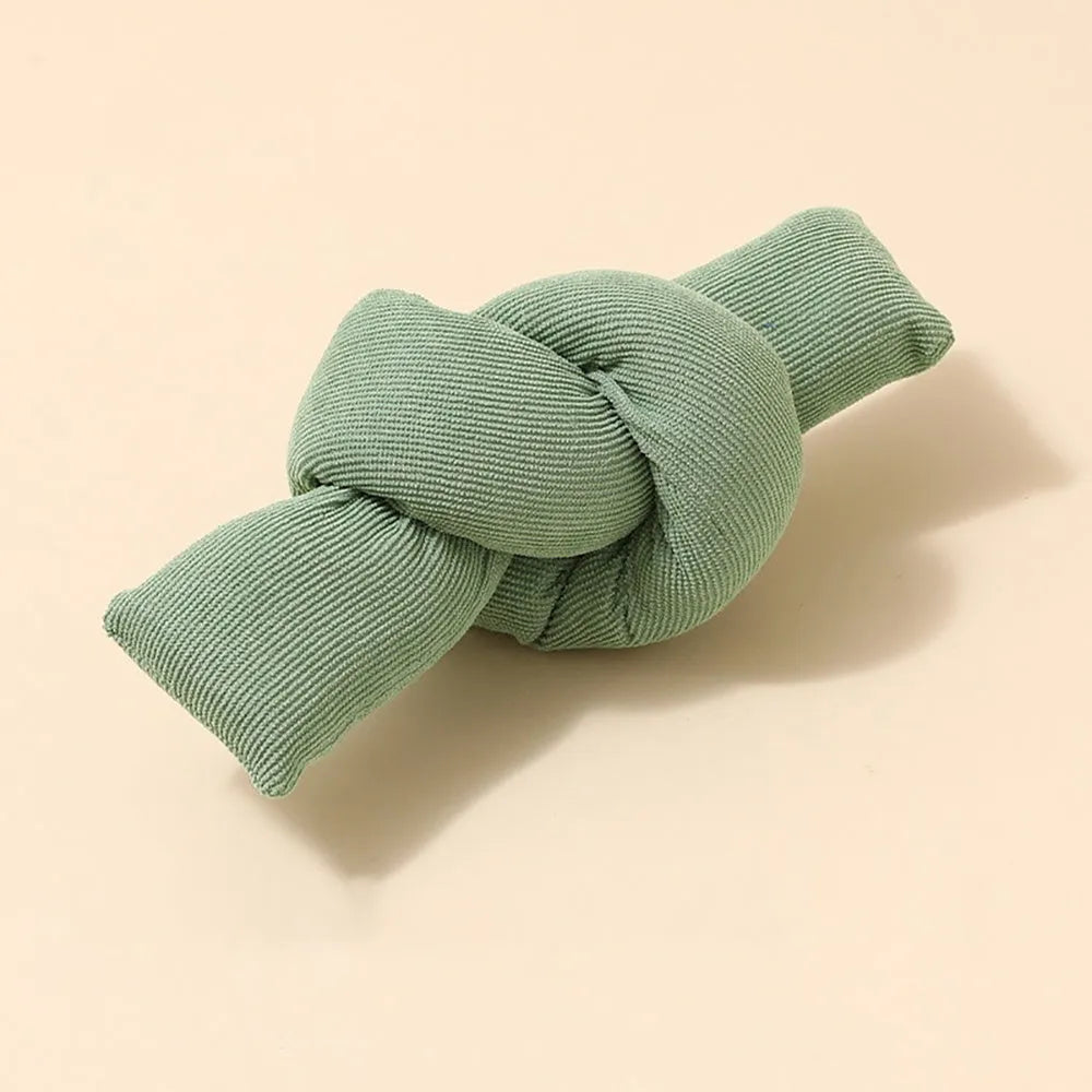White knotted cotton dog rope toy for tug of war and chewing.