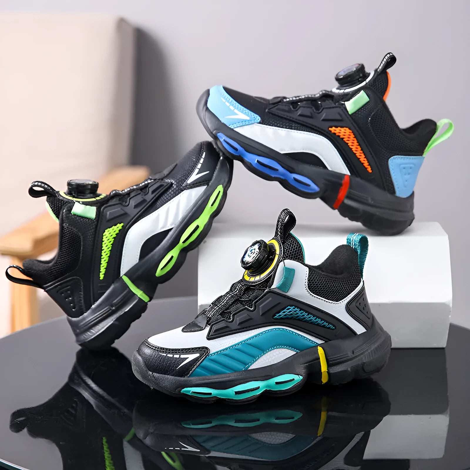 Children's waterproof leather basketball shoes with rotating buckle, black and grey colour, on natural lawn