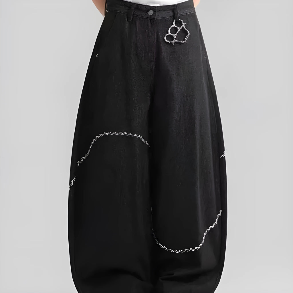 Black straight-leg denim trousers with a mid-waist and zip fly, laid flat.