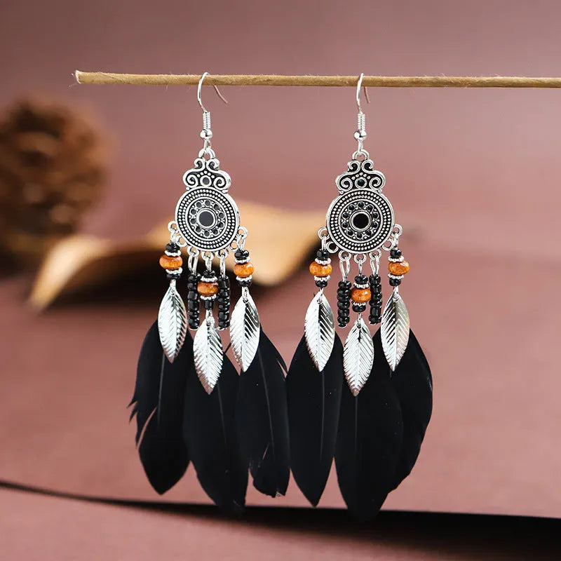 Round drop feather design alloy earrings with leaf pattern in a bohemian style, showing electroplated finish.