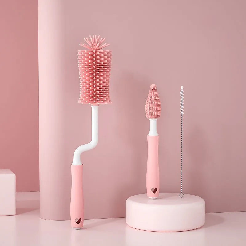 Silicone baby bottle brush set with main brush and separate straw cleaner in pink, blue and yellow colours.