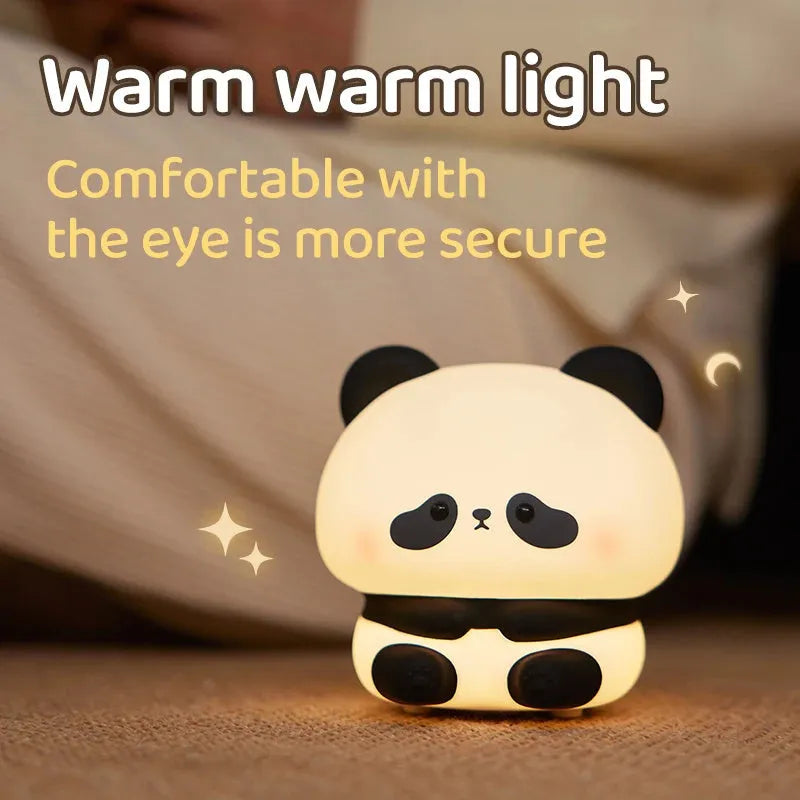Panda LED night light with soft silicone head, USB rechargeable, touch control, colourful lights, on a bedside table