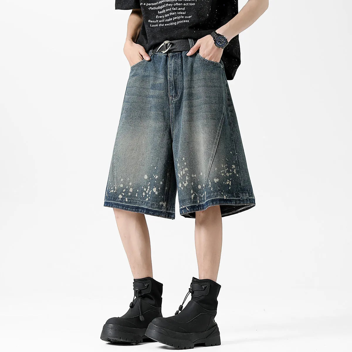 Men's retro blue denim shorts with distressed splash ink design and straight leg cut.