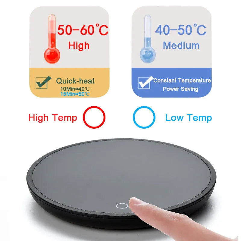 Black circular coffee mug warmer with a tempered glass surface on a desk.