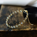 14K gold-plated women's bracelet with 6mm blue moonstone beads and metal starry sky accents