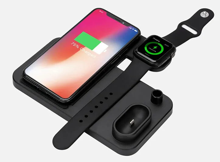 Black and white 4-in-1 wireless charging station showing phone on adjustable stand, Apple Watch, AirPods, and Apple Pencil charging simultaneously.