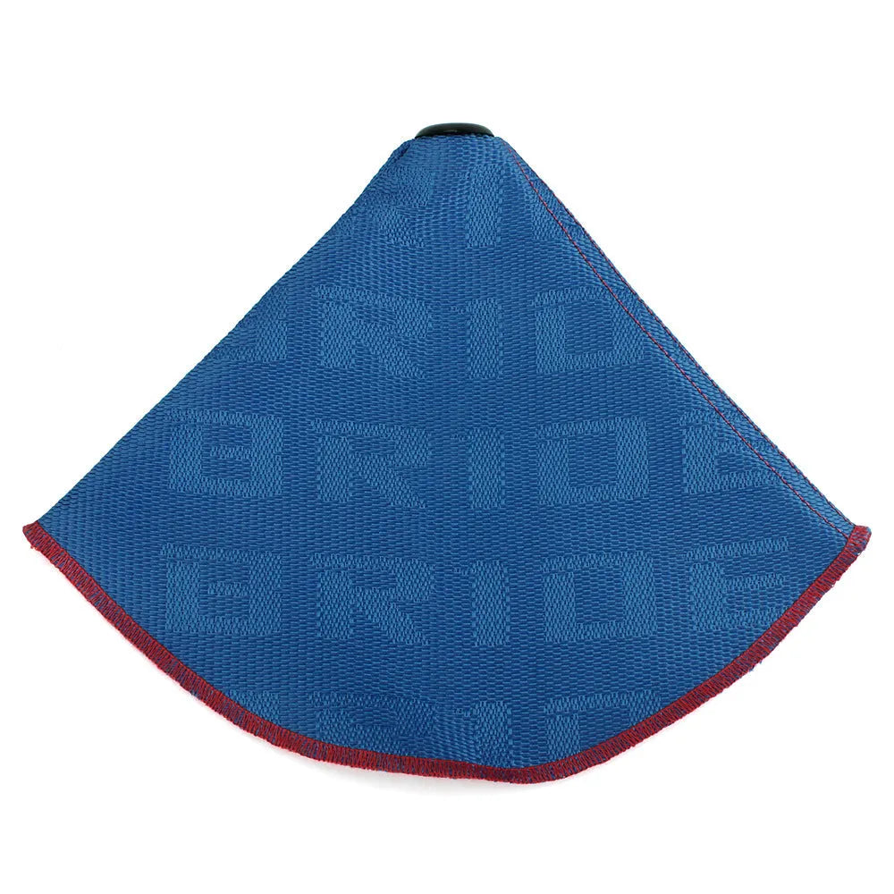 Canvas dust cover draped over a racing bucket seat in a vehicle interior.