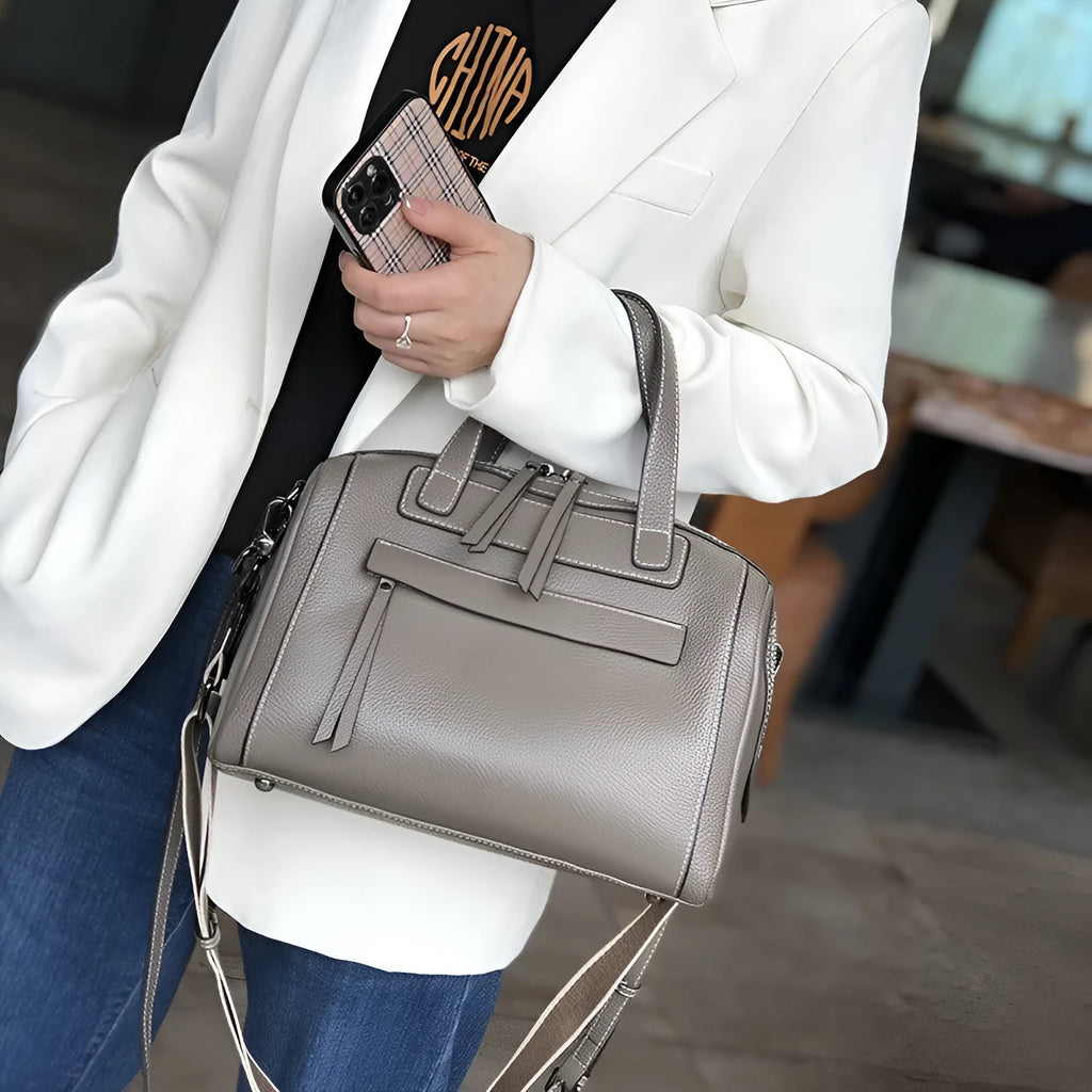 Genuine leather messenger bag with Boston lychee pattern stitching showing horizontal square shape and shoulder strap