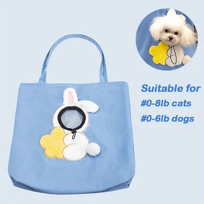 Blue canvas pet carrier bag with animal pattern, safety zippers, and side head opening for a dog