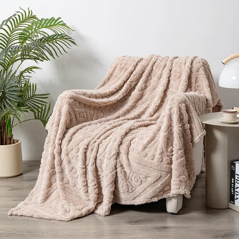Shu Cotton Velvet Jacquard blanket in fog blue with a woven plant flower pattern, laid flat.