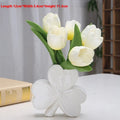 European style white porcelain ceramic vase on a desktop, shown in light green colour.