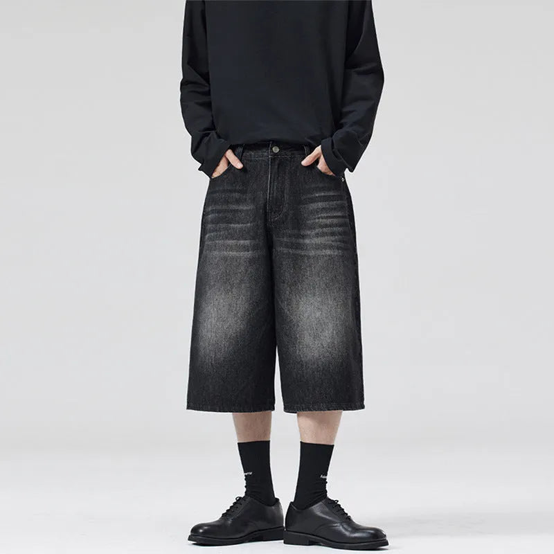 Men's loose fit straight-leg denim shorts in light blue on a plain background