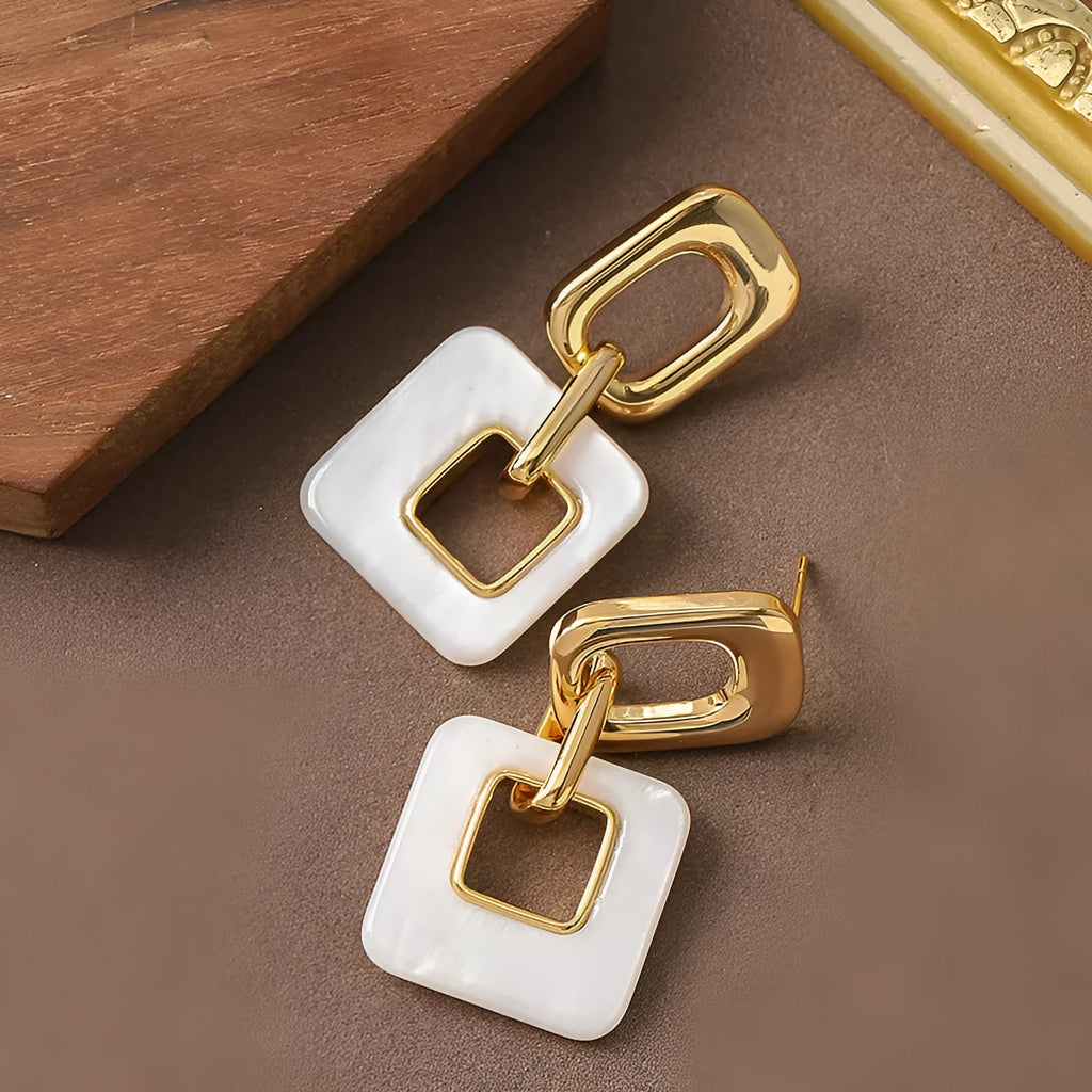 Hollow geometric square earrings with chamfered corners in silver or black