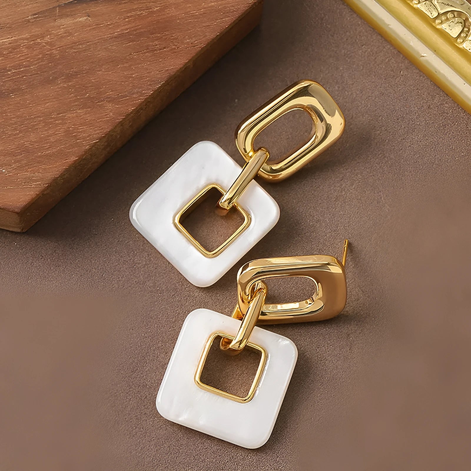 Hollow geometric square earrings with chamfered corners in silver or black
