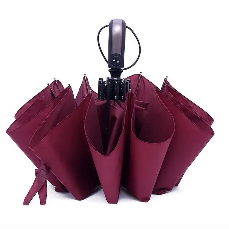 Triple folding black business umbrella with automatic opening mechanism and rubber handle