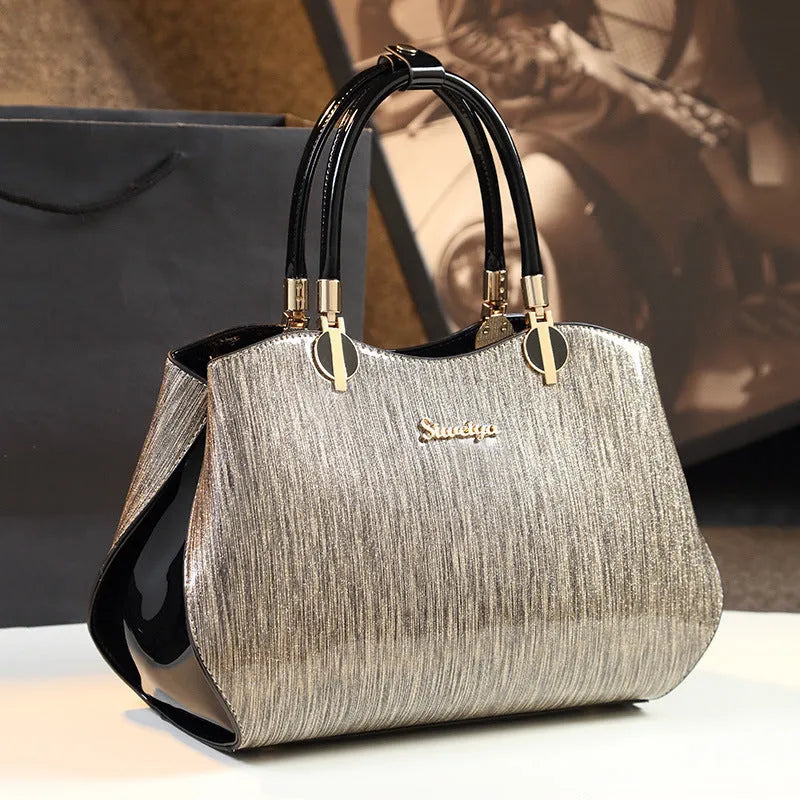 Women's medium horizontal square handbag with zipper closure and printed design, available in multiple colour options
