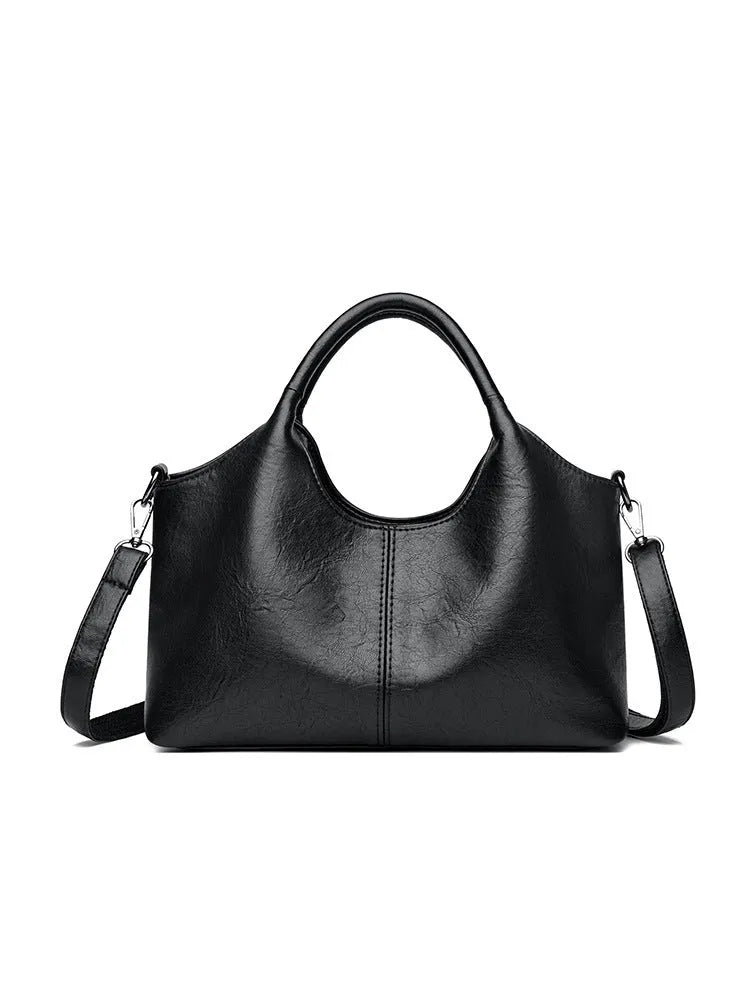 Genuine leather women's cross-body bag in multiple colours showing large capacity design