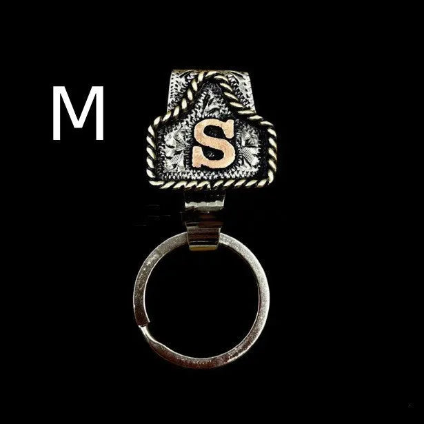 Handmade metal keychain with a cow tag charm in one of 26 available colour options.