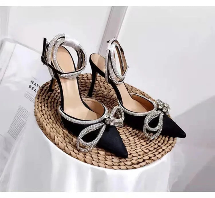 Women's black stiletto heel sandals with silk bandage detail on back and buckle fastening.