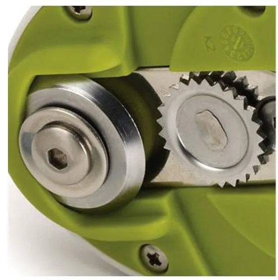 Compact manual can opener with stainless steel blade and ABS plastic body on a kitchen counter