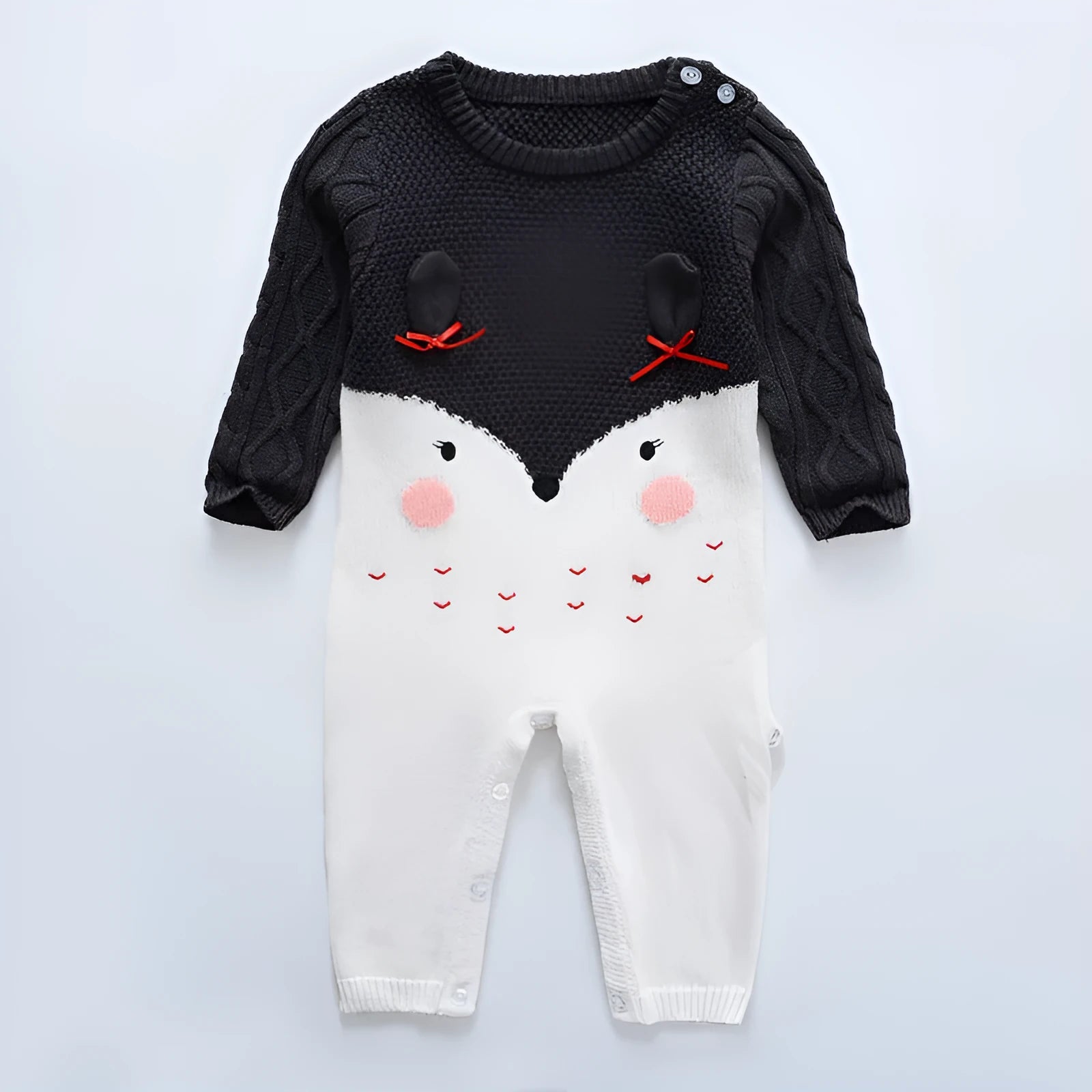Baby knitted cotton jumpsuit with long sleeves and concealed buttons in neutral colour for autumn winter