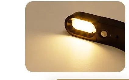 USB human body induction night light with light control, black colour, warm style LED lamp on bedside table