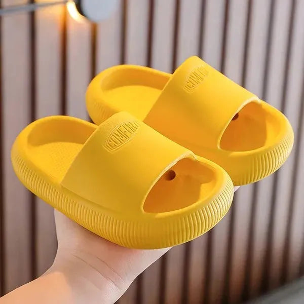Children's bright coloured EVA slippers with non-slip soles in blue, green, orange, pink, and yellow.