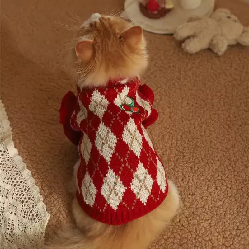 Red polyester cat sweater with rhombic embroidery cherry design, side view on white background