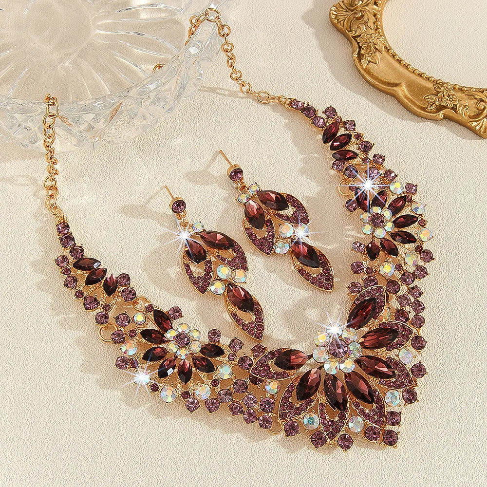 Gold high profile crystal necklace and earrings suite with exaggerated flower and wheat design on alloy