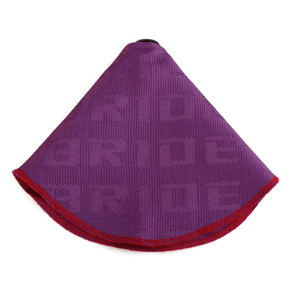 Canvas dust cover draped over a racing bucket seat in a vehicle interior.
