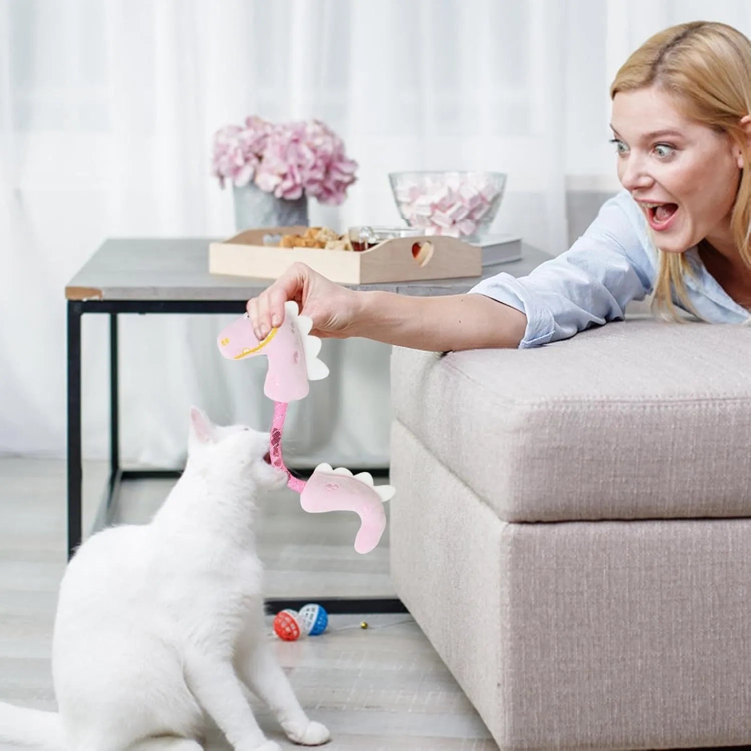 Bundle of four cat toys including rope toys, springs, kicker toys, and plush chew toys in pink, purple, or yellow colours