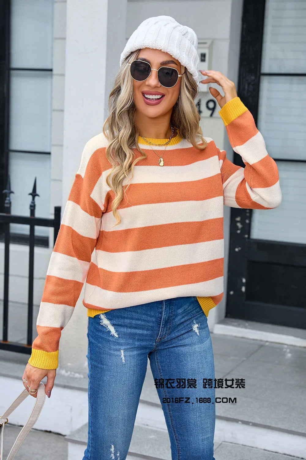 Women's loose striped acrylic sweater in blue colour with round neckline and long sleeves