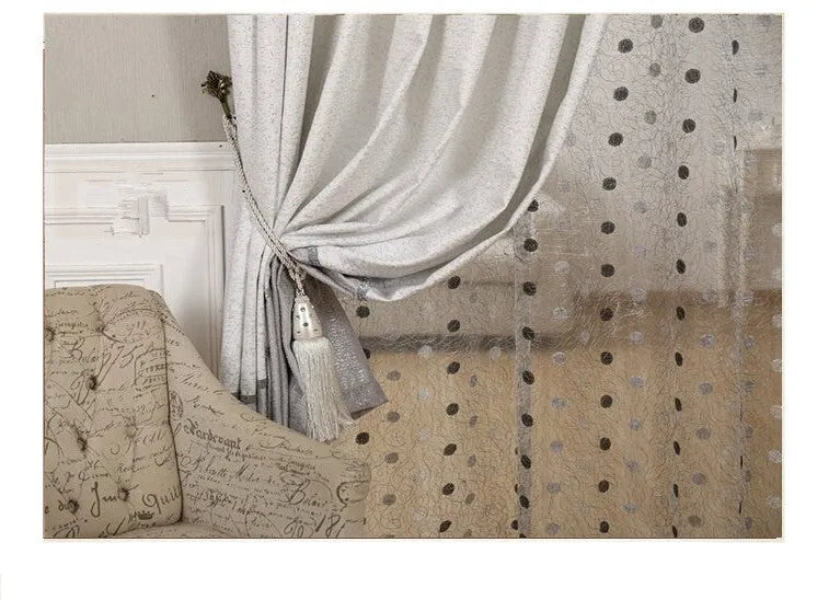 Single blackout curtain panel showing hook heading style with blackout lining visible at edge