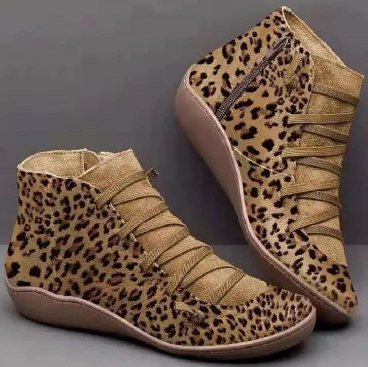 Women's casual ankle booties with a round toe, wedge heel, PU upper, and rubber sole in a selection of colours.