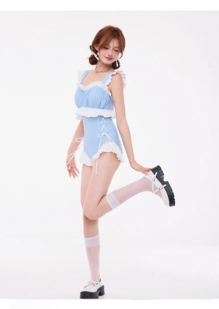 Light blue high-waist one-piece swimsuit with chest gather detail and backless design.