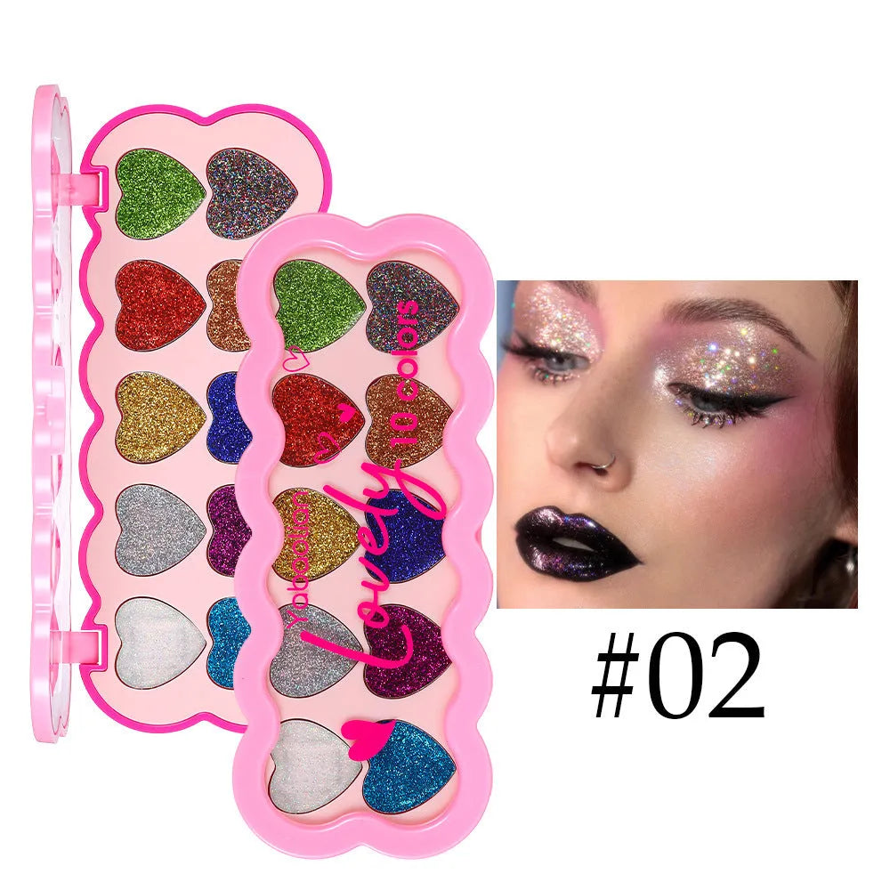 Heart-shaped ten-colour eye shadow palette with pearlescent sequin finishes in white, beige, pink, purple, brown, blue, black, royal blue, maroon, and coral.