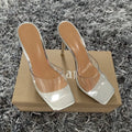 Women's black and silver high-heel ankle boots with a PVC sole on a white background.