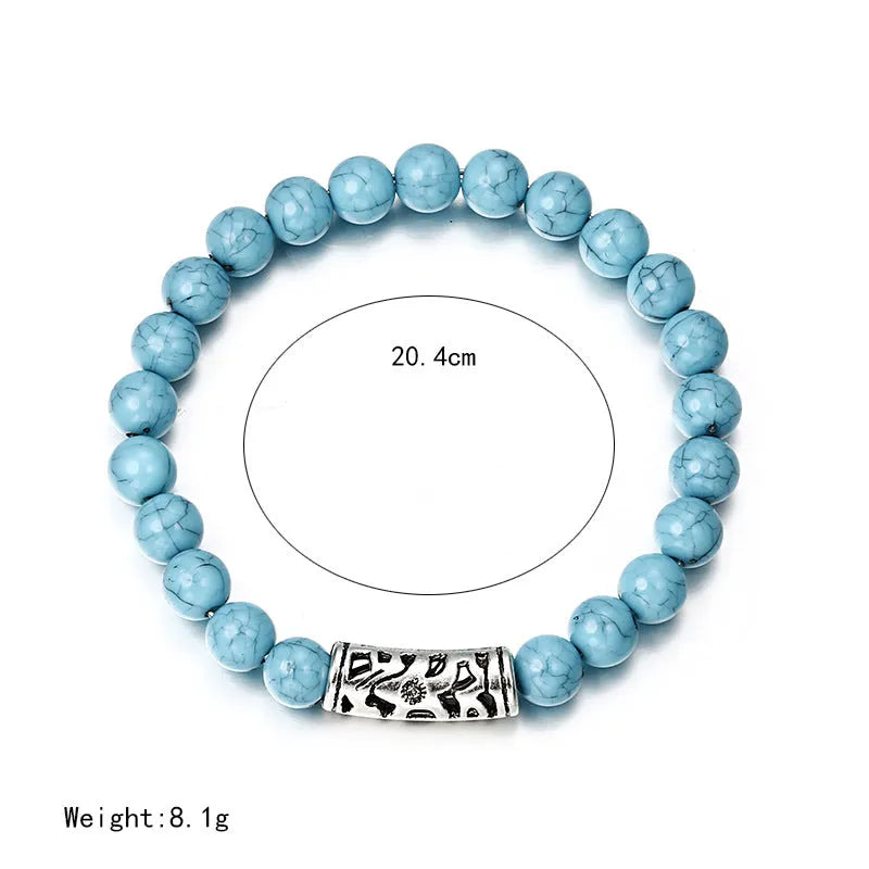 Classic acrylic blue beaded bracelet on stretch cord on a light background