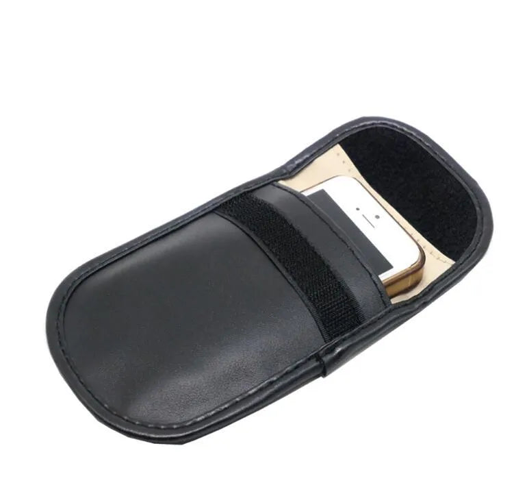 Black microfiber Faraday cage car key signal blocker case measuring 13.5 by 9.5 centimetres.