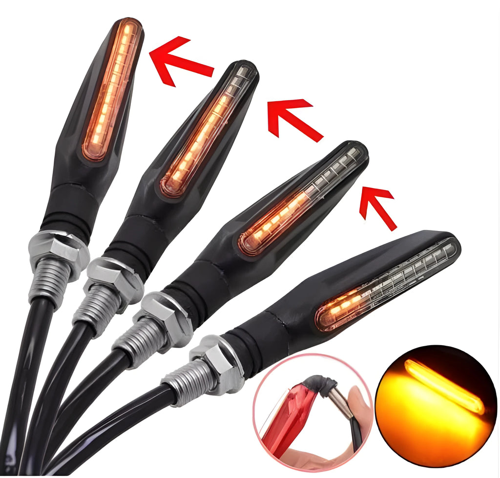 Four universal motorcycle LED turn signals with flowing water amber light, black flexible rubber housing, 2.5 x 11cm each