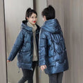 Women's loose thick winter hooded jacket in black colour with long sleeves